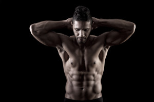 muscled man on a black background